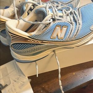 New Balance Light Blue and White Sneakers